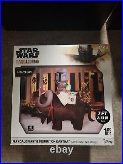 7' Star Wars Mandalorian & Grogu On Bantha Airblown Inflatable Christmas in hand