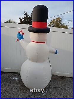Inflatable snowman with candy cane